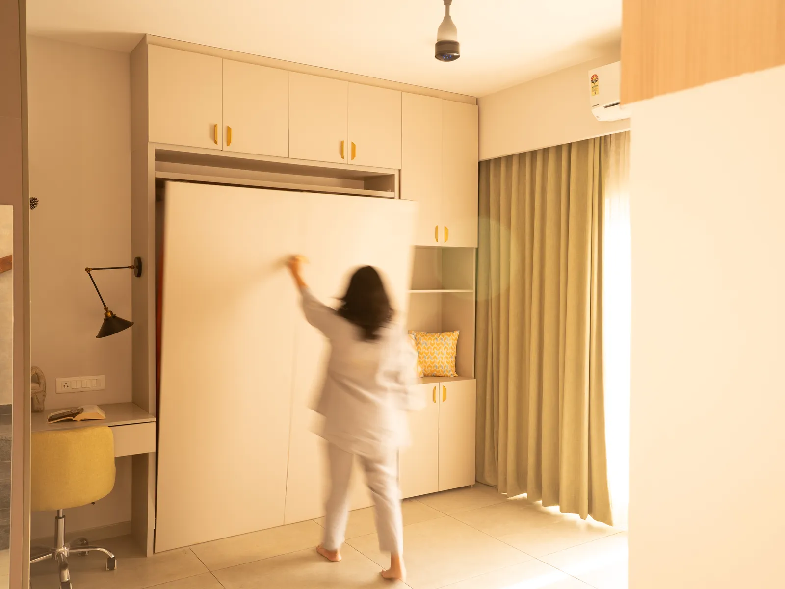 Fold-down wall bed in its closed position — Amlan's Residence